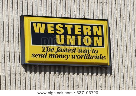 Kokomo - Circa September 2019: Western Union Signage And Logo. Western Union Sent Telegrams Over Tel
