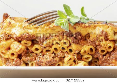 Greek Pastizio Noodle Dish With Cheese With A Fork