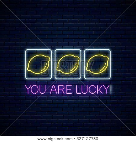 You Are Lucky - Glowing Neon Motivation Phrase With Three Lemons On Slot Machine. Slot Machine Win C