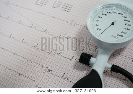 Sphygmomanometer With Aneroid Gauge With Electrocardiogram Paper. Sphygmomanometer With Aneroid Gaug