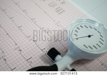 Sphygmomanometer With Aneroid Gauge With Electrocardiogram Paper. Sphygmomanometer With Aneroid Gaug