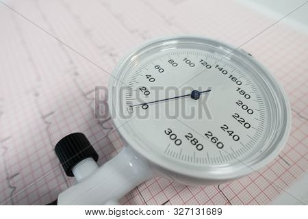 Sphygmomanometer With Aneroid Gauge With Electrocardiogram Paper. Sphygmomanometer With Aneroid Gaug