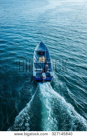 Tumaco, Nariño / Colombia, June 27, 2019: Man On Blue Empty Speed Boat In The Bay