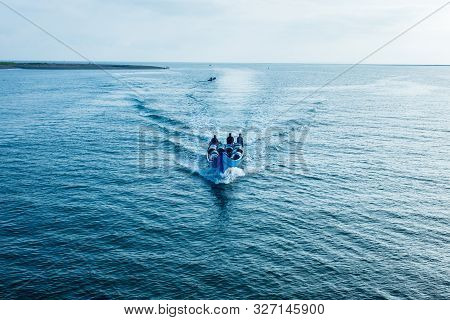 Tumaco, Nariño / Colombia, June 27, 2019: Many Men On Blue Speed Boat Fill With Merchandise Crusing 