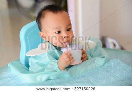 Asian Baby Boy 7 Months Old Eating With Baby Led Weaning (blw) Method, Self-feeding