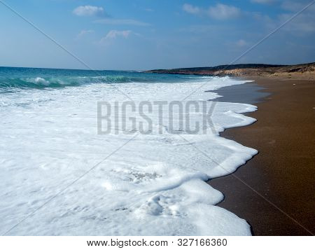 Foam And Waves In The Sea On A Sunny Day. Foam And Waves In The Sea. Powerful Waves Crushing For Bac