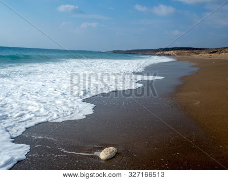 Foam And Waves In The Sea On A Sunny Day. Foam And Waves In The Sea. Powerful Waves Crushing For Bac