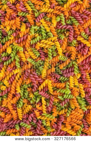 Abstract Texture Of Colorful Pasta. Pattern Of Macaroni. Bright Multicolor Background. Uncooked Colo