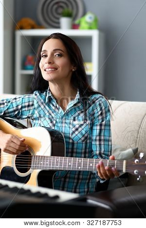 Portrait Of Wonderful Brunette Wearing Casual Checkered Blouse. Beautiful Woman Looking At Camera Wi