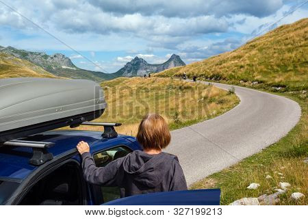 Woman With Car (model Unrecognizable) On Durmitor Panoramic Road. Picturesque Summer Mountain Landsc