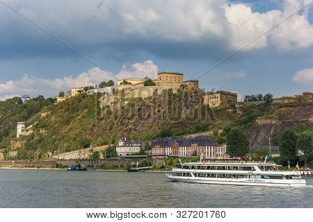 Koblenz, Germany - August 03, 2019: Cruise Boat Passing The Historic Ehrenbreitstein Fortress In Kob