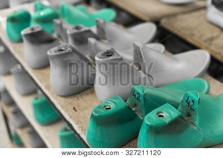 Plastic Lasts Used In The Manufacture Of Shoes. Row Of Plastic Shoe Lasts Used To Manufacture Modern