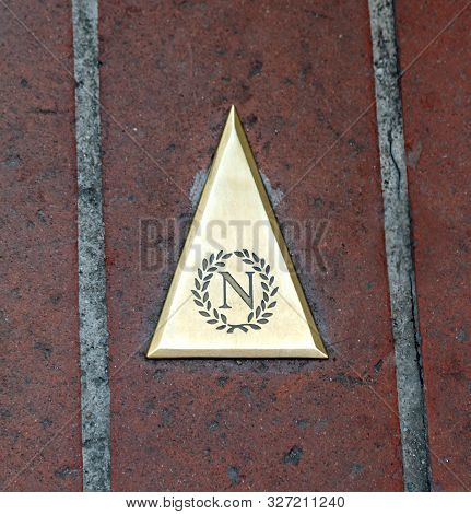 Ajaccio, France - August 25, 2019: Golden Symbol Of Napoleon Bonaparte And The Arrow To His House
