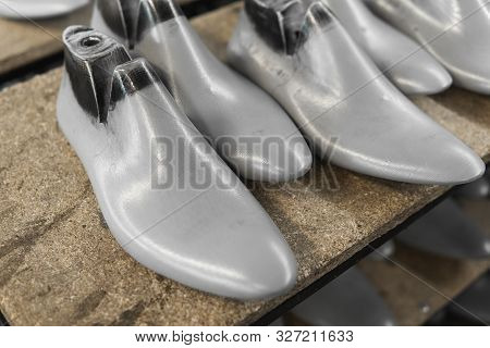 Plastic Lasts Used In The Manufacture Of Shoes. Row Of Plastic Shoe Lasts Used To Manufacture Modern