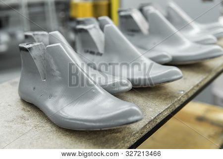 Plastic Lasts Used In The Manufacture Of Shoes. Row Of Plastic Shoe Lasts Used To Manufacture Modern