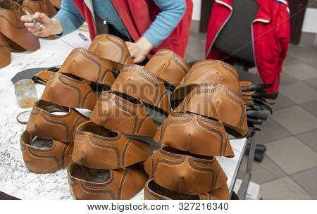 Stitched Shoes Without Soles At The Shoe Factory. Prepared, Bundled Leather Parts, Used In The Produ