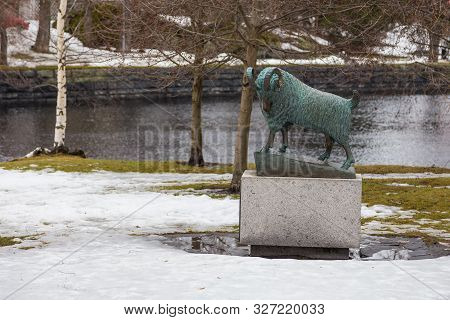 Savonlinna, Finland- 03 March 2015: Statue Of A Ram On The Tallisaari Island. Bronze Sculpture On A 