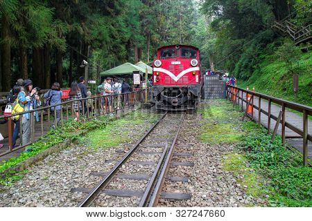Alishan,taiwan-october 14,2018:red Train Stop In Foggy Day At Alishan Train Station On Alishan Mount