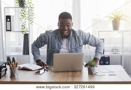 Pay Raise. Joyful African American Worker Looking At Laptop Screen With Excitement, Happy After Rece