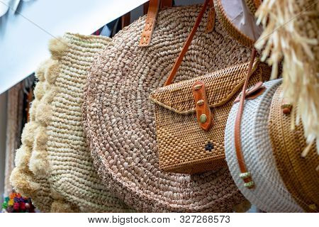 Balinese Traditional Handmade Rattan Woven Round Shoulder Bags With Leather Handles At A Souvenir St