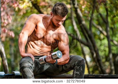 Handsome Muscular Shirtless Hunk Man Outdoor In Outdoor Setting. Showing Healthy Body. Halfnaked Spo