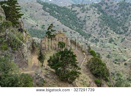 Northeast Of La Gomera Island. Narrow Winding Serpentine Of Mountain Dirt Road. Old Volcanic Mountai