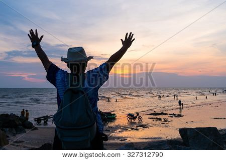 Traveler Backpacker Of Freedom Style Concept: Silhouette Of Asian Young Woman Relaxing Standing On R
