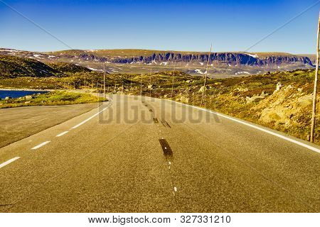 Road Crossing Hardangervidda Plateau, Norway Landscape. National Tourist Hardangervidda Route.