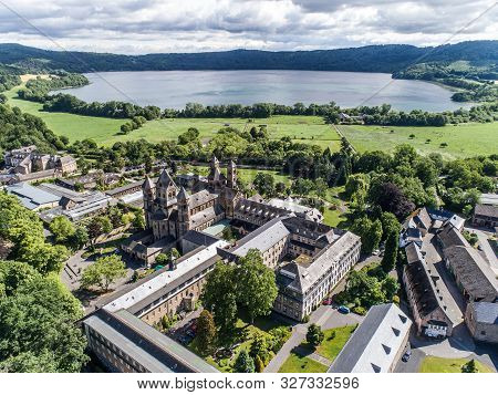 Aerial View On Laacher See Behind The Famous Abbey Maria Laach In Rhineland-palatinate, Germany