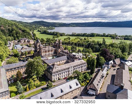 Aerial View On Laacher See Behind The Famous Abbey Maria Laach In Rhineland-palatinate, Germany