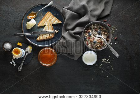 Breakfast Served With Oatmeal And Fruits, Boiled Egg, Jam And Butter. Delicious Healthy Breakfast.
