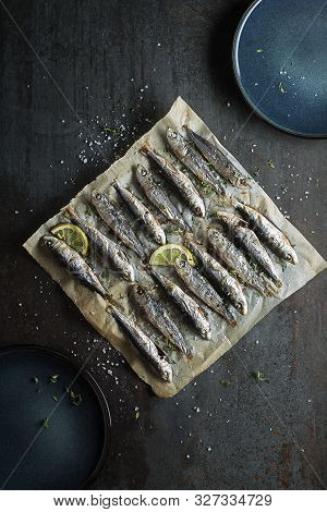 Grilled Sardines With Lemon And Herbs Close Up. Healthy Vegetarian Fish Meal