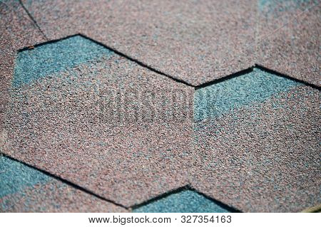 Modern Roof Shingles Tiles, Close Up. Soft Asphalt Roof Cover. New Roofing Construction. Easy Roofin