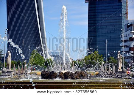 Milano, Italy, 14.07.2019: Fountain Of The Four Seasons At Piazzale Giulio Cesare, With The Three To