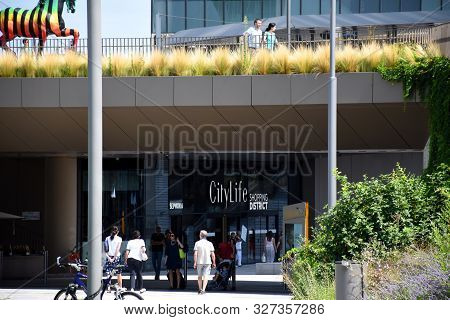 Milan, Italy - 07.14.2019: Entrance Of The Citylife Shopping Center At The Bottom Of The Three Tower
