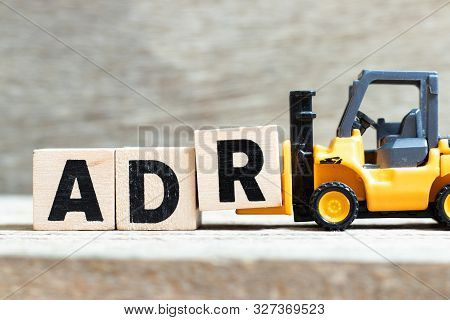 Toy Forklift Hold Letter Block R To Complete Word Adr (abbreviation Of Adverse Drug Reaction) On Woo