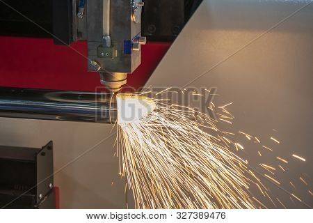 The Fiber Laser Cutting Machine Cutting The Stainless Steel Tube Control By Cnc Program. The Sheet M