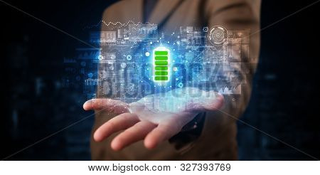 Elegant hand holding battery with full of energy