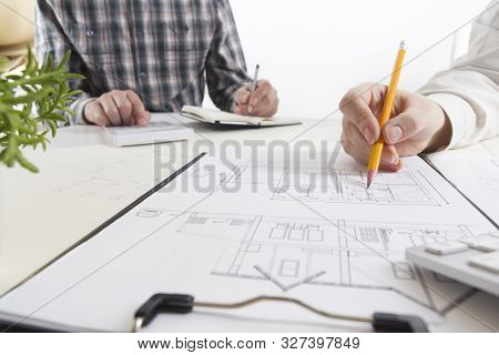 Architects Working On Blueprint, Real Estate Project. Architect Workplace. Construction Concept. Eng