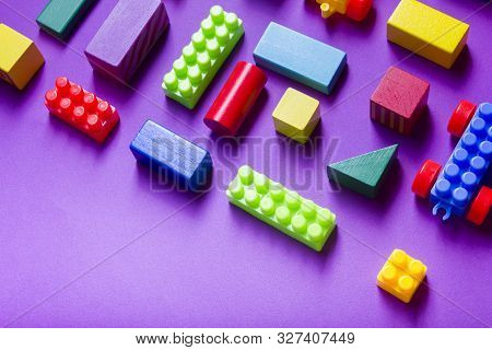 Colorful Kids Toys Frame On Wooden Background. Top View. Flat Lay. Copy Space For Text.