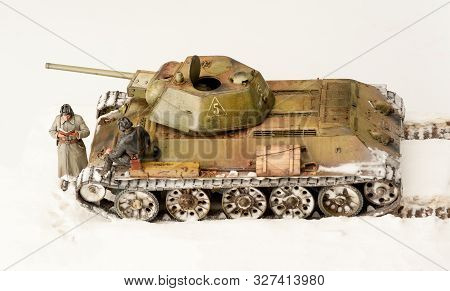 Legendary Soviet Tank T-34 At War In The Second World War. Winter View Diorama With Two Officers