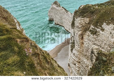 West Coast Of France. Étretat. Great View From A Great Height. The Sea Beats Against Rocks And Stone