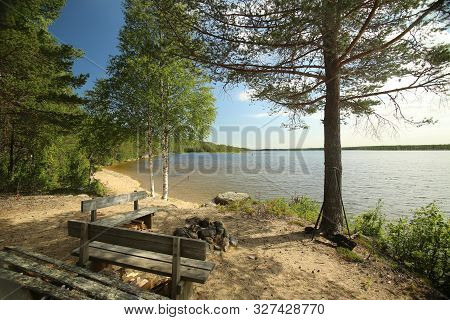 Sand Beach At Lake Vargforsdammen, A Reservoir In The Stream Skelleftealven In Northern Sweden