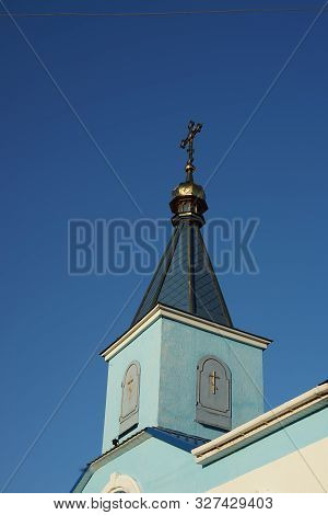 Rural Orthodox Church Against The Blue Sky.