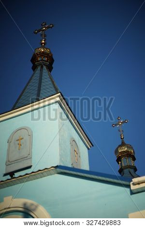 Beautiful Rural Orthodox Church Against The Blue Sky.