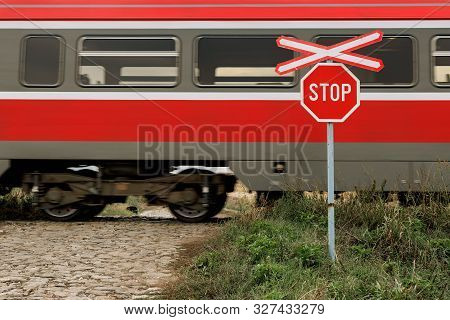 St Andrew's Cross And Stop Sign At Railroad Level Crossing