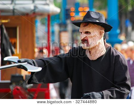 Amsterdam / Netherlands - August 8, 2015: Actor In Freddy Krueger Costume In The Central Dam Square 