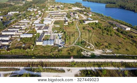 Sand Hills Of Quarry With A Pond And Abandoned Prison In Rummu Estonia Europe. Flooded Houses Of For