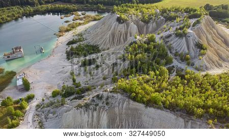 Sand Hills Of Quarry With A Pond And Abandoned Prison In Rummu Estonia Europe. Flooded Houses Of For