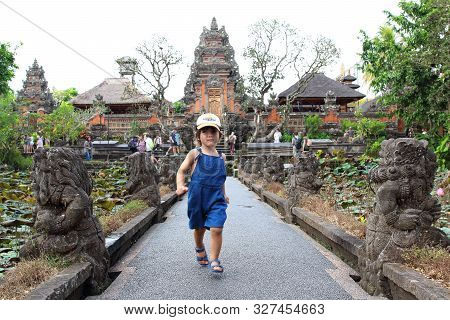 Ubud, Bali, Indonesia - August 6th Of 2019: Cute Little Kid Having Fun In Pura Taman Saraswati 